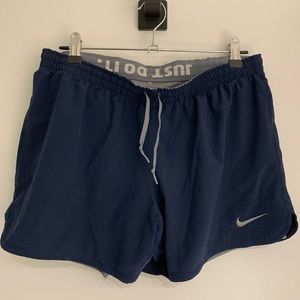Nike dri-fit sport shorts with built in spandex. Two toned grey and blue. Size M